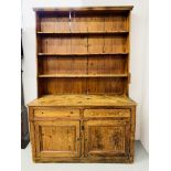 RUSTIC ANTIQUE PINE FARMHOUSE DRESSER THE TWO DOOR BASE WITH TWO DRAWERS AND OPEN SHELVED TOP.