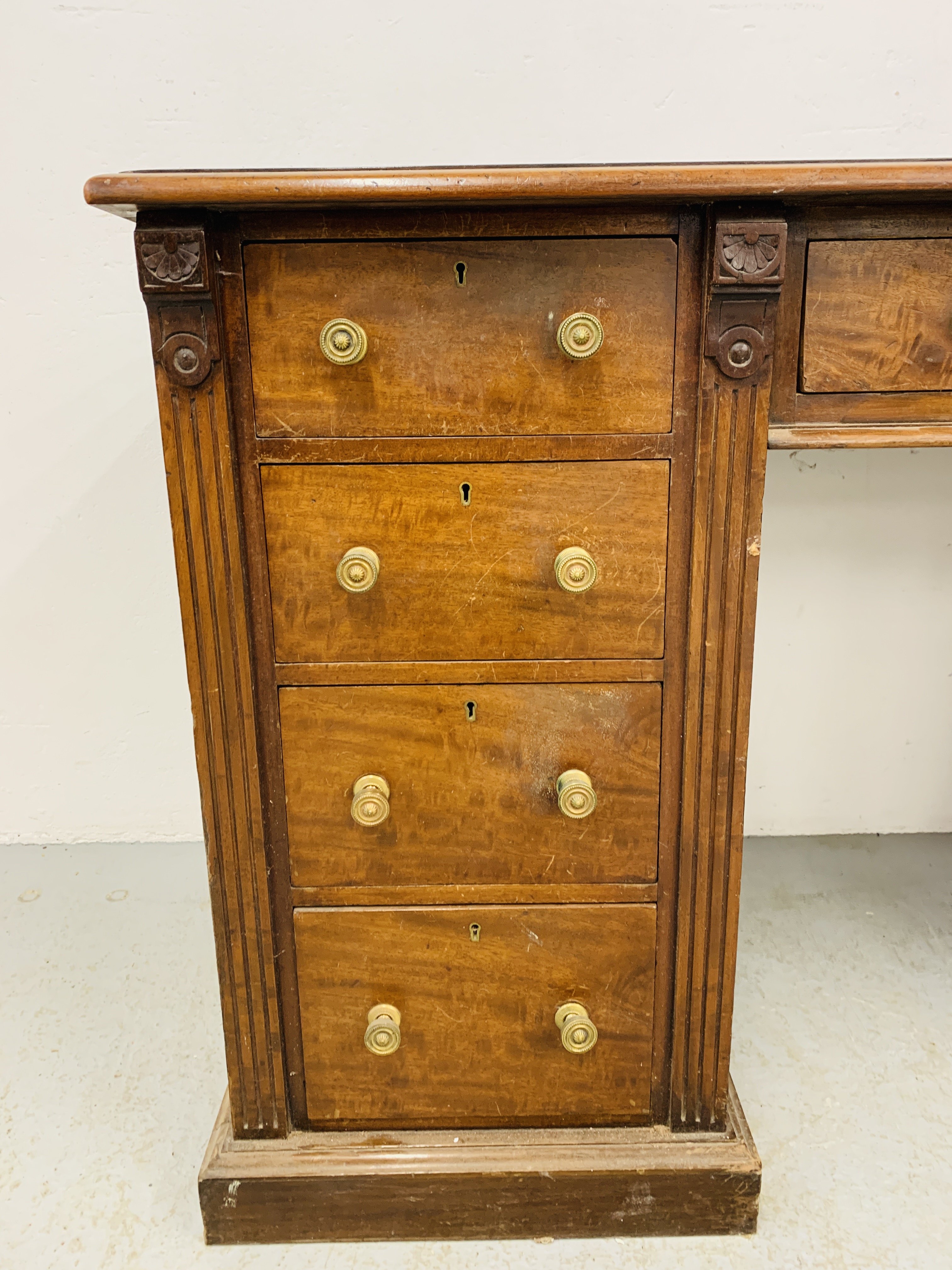 An Edwardian mahogany single piece nine drawer pedestal desk with inlaid tan leather top, - Image 6 of 18