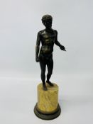 A bronze figure of a nude classical male on circular plinth,