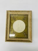 A framed wax medallion of classical figures,