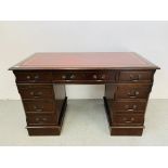 A C20TH MAHOGANY PEDESTAL DESK OF NINE DRAWERS AND INSET LEATHER TOP. H 77cm. W 124cm. D 62cm.