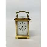 A BRASS CARRIAGE CLOCK, THE ENAMELLED DIAL WITH ROMAN NUMERALS MARKED J.E.