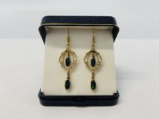 A PAIR OF 9CT GOLD DROP EARRINGS EACH SET WITH TWO OVAL OPALS.