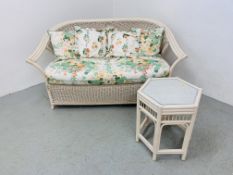 A WICKER AND CANE CONSERVATORY SOFA AND CANE HEXAGONAL OCCASIONAL TABLE
