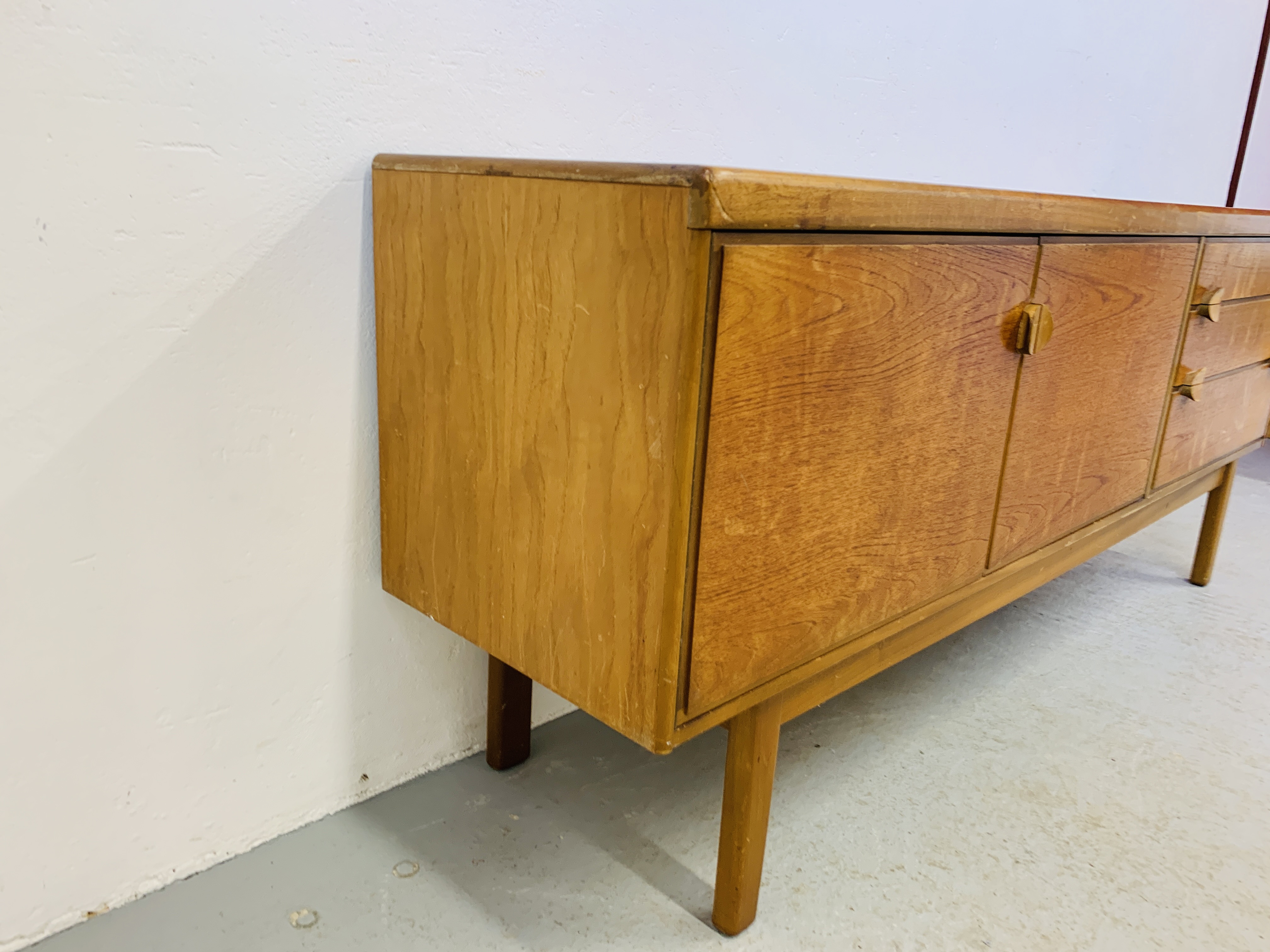 A RETRO TEAK FINISH SIDEBOARD WITH THREE DRAWERS AND TWO CABINET DOORS - LENGTH 184CM. DEPTH 45CM. - Image 13 of 13