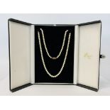 A SINGLE STRAND CULTURED PEARL NECKLACE WITH 9CT GOLD CLASP