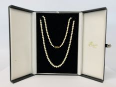 A SINGLE STRAND CULTURED PEARL NECKLACE WITH 9CT GOLD CLASP