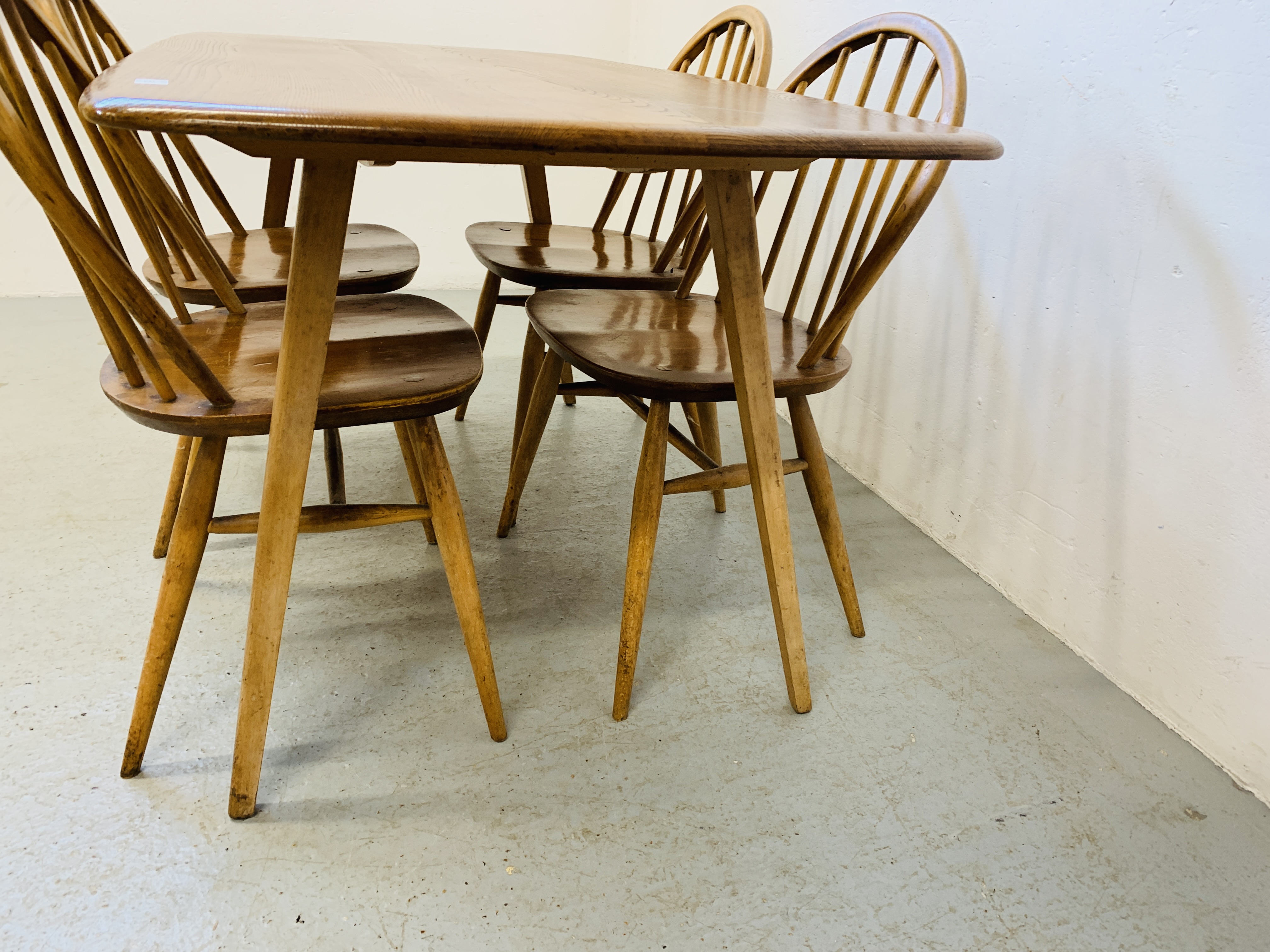 AN ERCOL ELM RECTANGULAR DINING TABLE 153CM X 77CM ALONG WITH A SET OF FOUR ERCOL STICK BACK DINING - Image 6 of 9