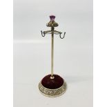 A SILVER HAT PIN STAND WITH AMETHYST FINIAL BY A & S, BIRMINGHAM 1908, HEIGHT 15.5CM.