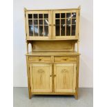 AN ANTIQUE STRIPPED AND WAXED PINE GLAZED TOP DRESSER,