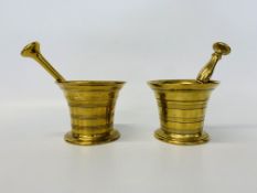 TWO GEORGIAN BRASS PESTLE AND MORTARS, ONE STAMPED TURNER & CO.