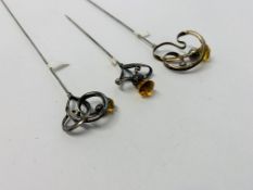 THREE SILVER HAT PINS, ALL BY CHARLES HORNER, EACH SET WITH A SINGLE AMBER STONE, 60, 81 & 9.