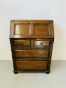 AN OAK FALLING FRONT TWO OVER TWO DRAWER BUREAU WITH FITTED INTERIOR