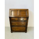 AN OAK FALLING FRONT TWO OVER TWO DRAWER BUREAU WITH FITTED INTERIOR