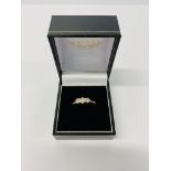 A 9CT GOLD THREE STONE DIAMOND RING