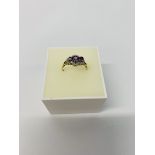 A 9CT GOLD AMETHYST AND DIAMOND SET DRESS RING