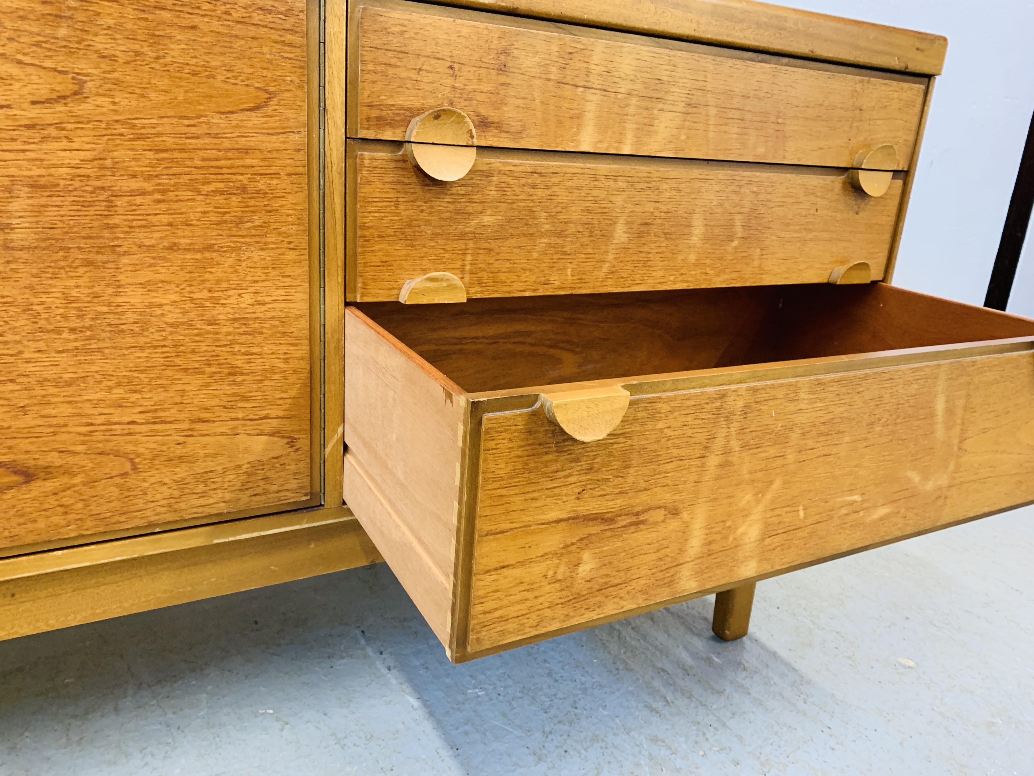 A RETRO TEAK FINISH SIDEBOARD WITH THREE DRAWERS AND TWO CABINET DOORS - LENGTH 184CM. DEPTH 45CM. - Image 10 of 13