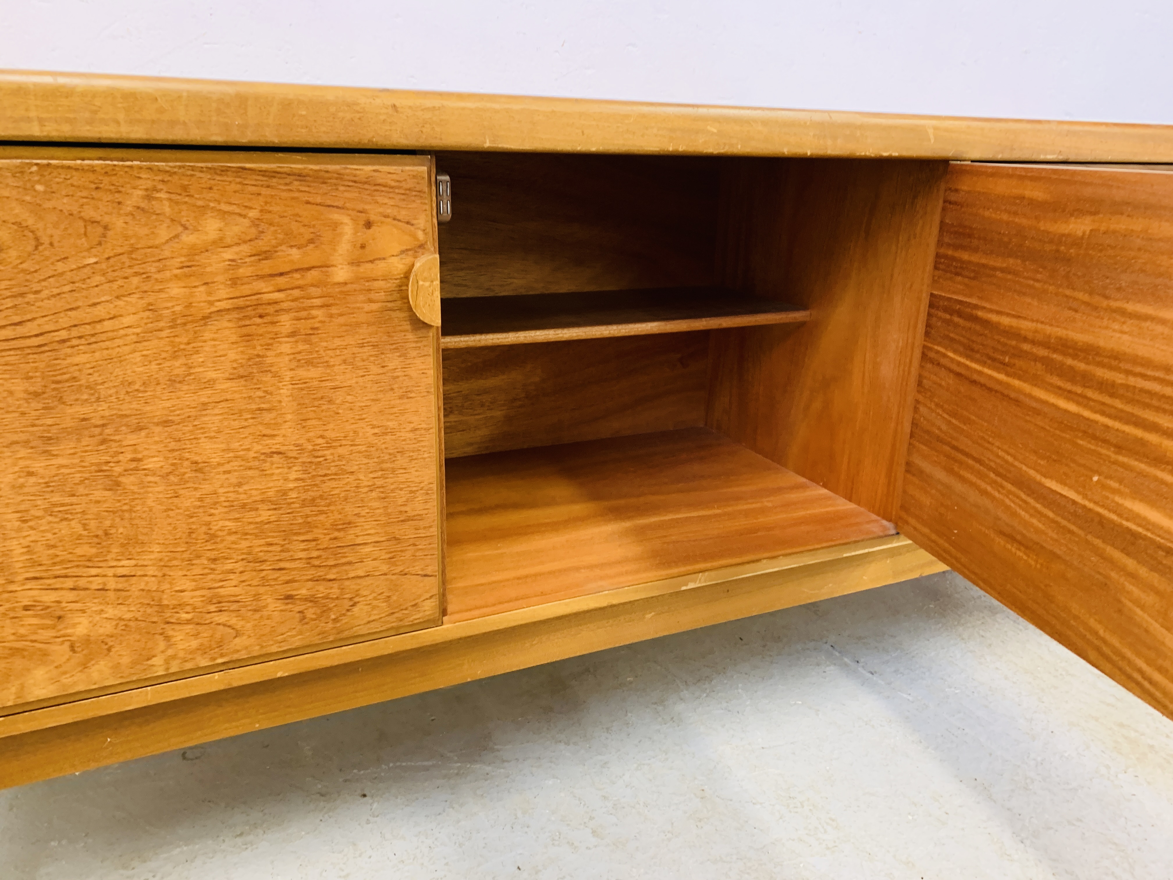 A RETRO TEAK FINISH SIDEBOARD WITH THREE DRAWERS AND TWO CABINET DOORS - LENGTH 184CM. DEPTH 45CM. - Image 12 of 13