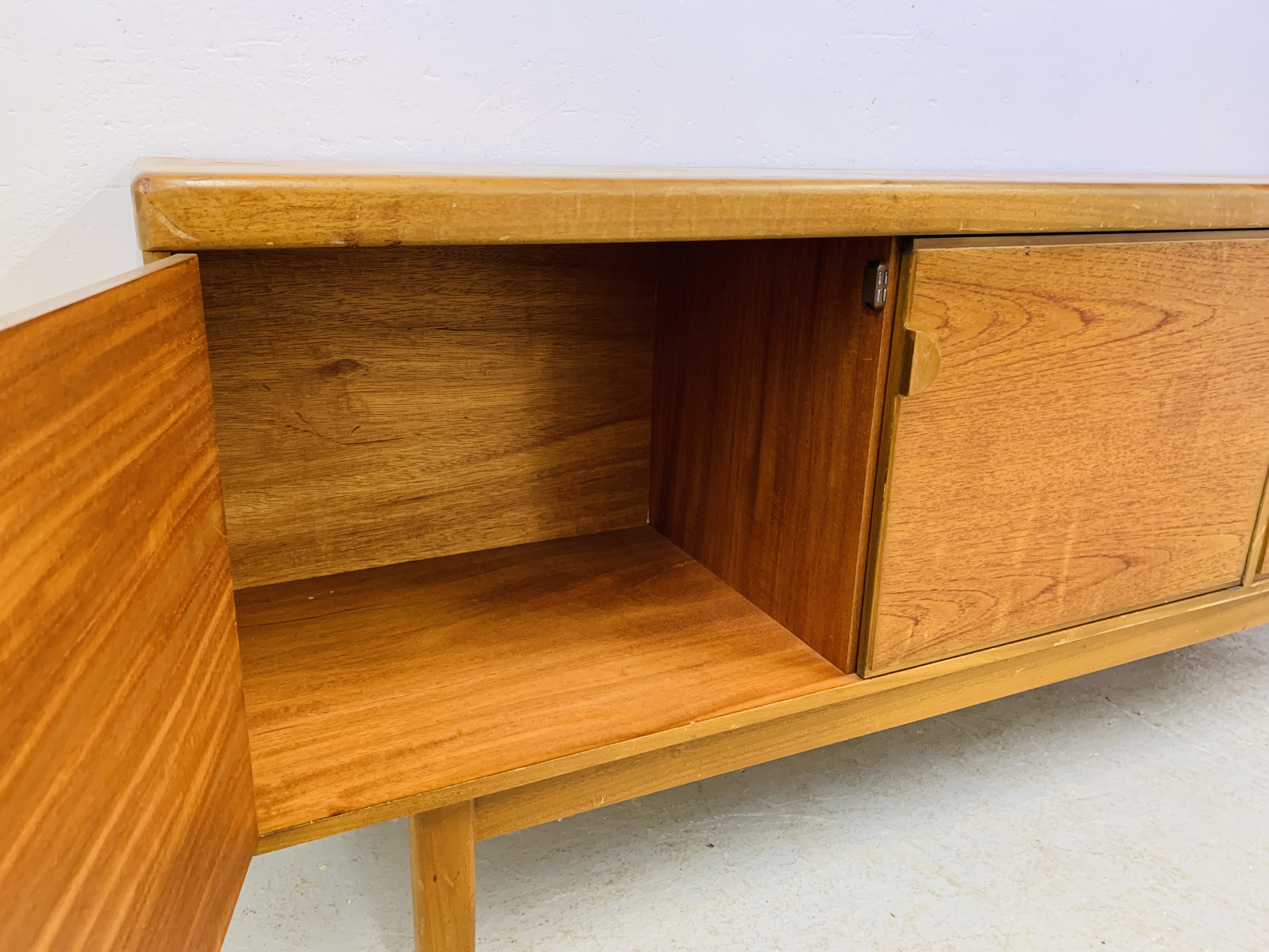 A RETRO TEAK FINISH SIDEBOARD WITH THREE DRAWERS AND TWO CABINET DOORS - LENGTH 184CM. DEPTH 45CM. - Image 11 of 13