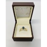A 9CT GOLD CORNFLOWER BLUE SAPPHIRE AND DIAMOND RING