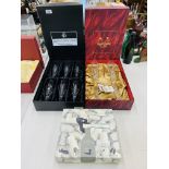 A SET OF SIX BOXED ROYAL DOULTON DORCHESTER FLUTE CRYSTAL WINE GLASSES ALONG WITH A BOXED PAIR OF