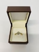 A 9CT GOLD DIAMOND SET CLUSTER RING