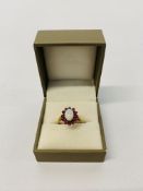 A 9CT GOLD OPAL AND RUBY SET RING,