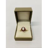 A 9CT GOLD OPAL AND RUBY SET RING,