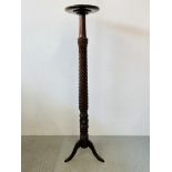 A REPRODUCTION TORCHERE, THE RIVEN AND DETAILED COLUMN STANDING ON TRIPOD BASE - HEIGHT 143CM.