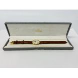 A GENTLEMANS OMEGA DEVILLE WRIST WATCH 9CT GOLD CASE ON TAN LEATHER STRAP
