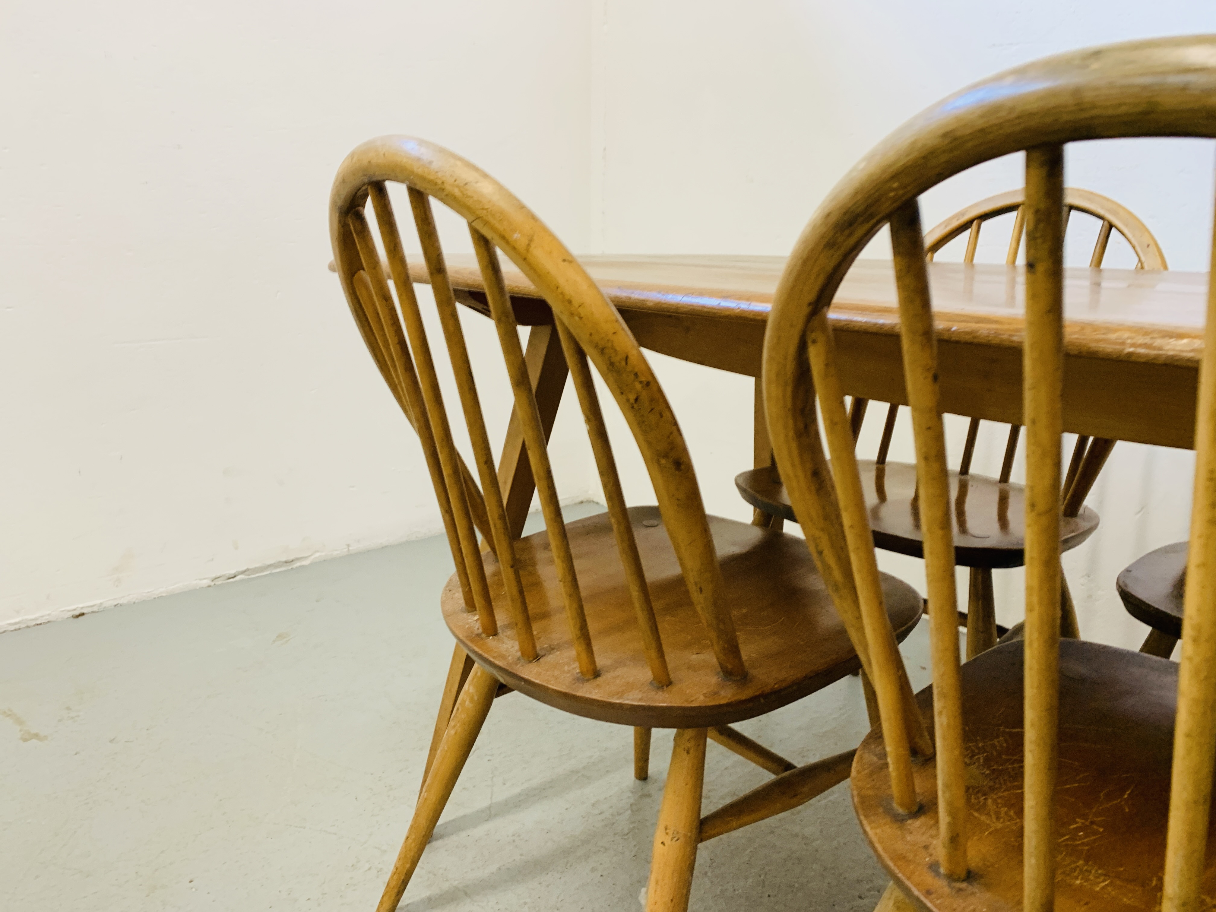 AN ERCOL ELM RECTANGULAR DINING TABLE 153CM X 77CM ALONG WITH A SET OF FOUR ERCOL STICK BACK DINING - Image 8 of 9