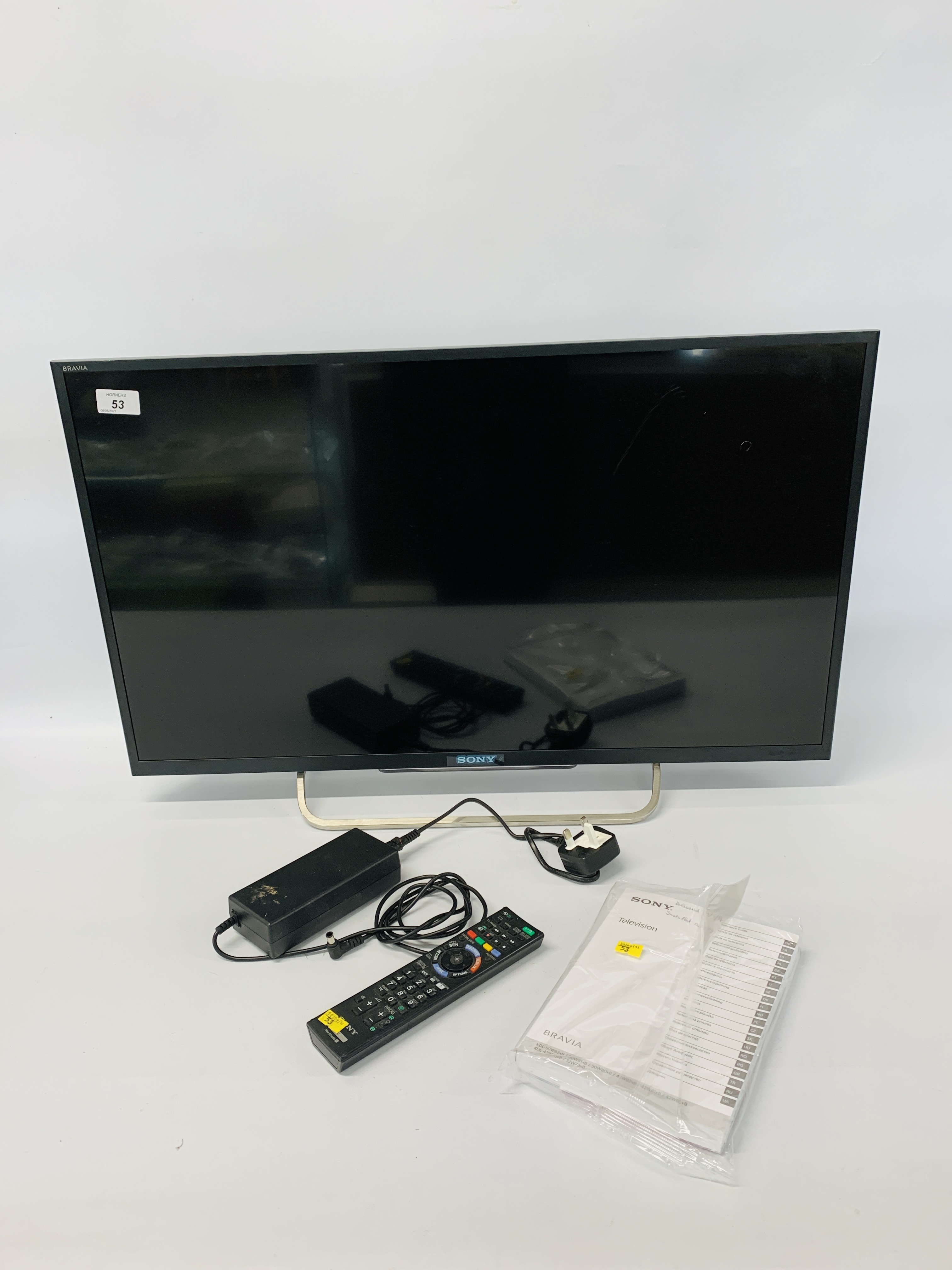 A SONY BRAVIA 32 INCH SMART TELEVISION MODEL KDL - 32W705B (REMOTE WITH AUCTIONEER) - SOLD AS SEEN