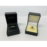 A 9CT GOLD BLUE AND WHITE STONE SET DRESS RING ALONG WITH A 9CT GOLD DIAMOND SET WISHBONE RING