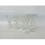 SET OF 6 HAND BLOWN WINE GLASSES TOGETHER WITH 5 CHAMPAGNE FLUTES BEARING LION MOTIF TO BASE