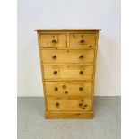 A WAXED COUNTRY PINE TWO OVER FOUR CHEST OF DRAWERS - W 69CM. H 120CM. D 51CM.