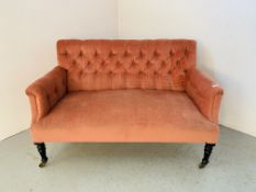 A VICTORIAN PINK VELOUR UPHOLSTERED BUTTON BACK COUCH - WIDTH 130CM.