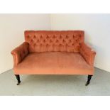 A VICTORIAN PINK VELOUR UPHOLSTERED BUTTON BACK COUCH - WIDTH 130CM.