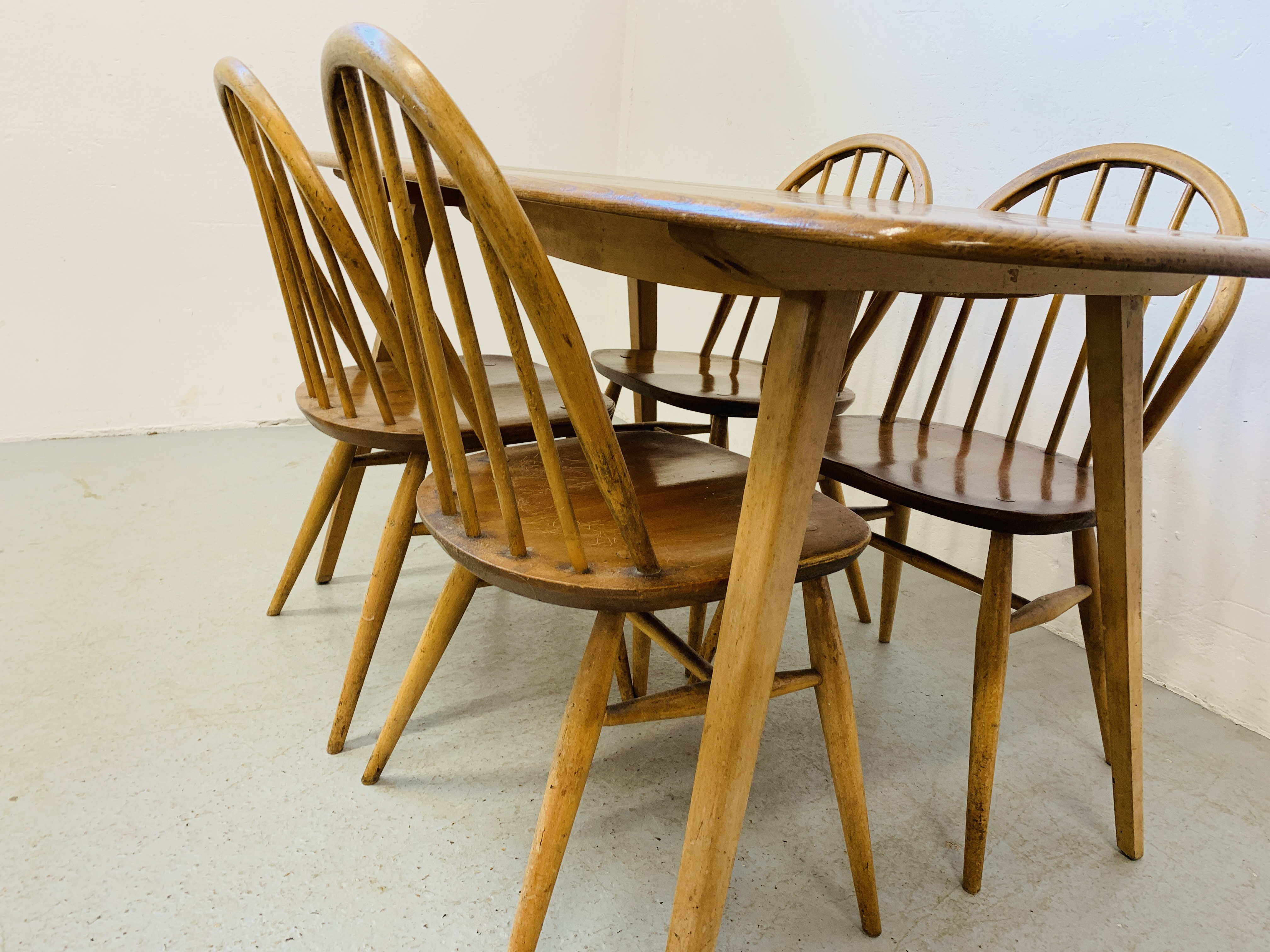 AN ERCOL ELM RECTANGULAR DINING TABLE 153CM X 77CM ALONG WITH A SET OF FOUR ERCOL STICK BACK DINING - Image 7 of 9