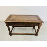 A HAND CARVED OAK SIDE TABLE WITH HINGED TOP AND BOBBIN DETAILED SUPPORTS - W 75CM. D 37CM. H 46CM.