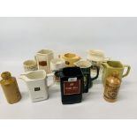 A COLLECTION OF 9 BAR TOP ADVERTISING WATER JUGS TO INCLUDE GREEN KING, JAMESON, DUNHILL,