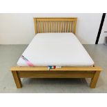 A MODERN LIGHT OAK DOUBLE BEDSTEAD WITH PERDORMIRE MEMORY FOAM MATTRESS