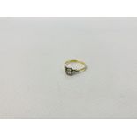 A SOLITAIRE DIAMOND RING MARKED 18CT