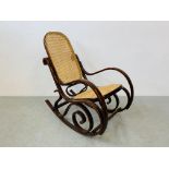 A BENTWOOD ROCKING CHAIR WITH RATTAN SEAT AND BACK