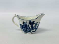 AN C18TH CENTURY BLUE AND WHITE CREAM JUG PAINTED WITH ORIENTAL DESIGN BELIEVED TO BE CAUGHLEY