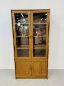 AN OAK EFFECT FINISH PART GLAZED DISPLAY CABINET - W 91CM. D 40CM. H 182CM.