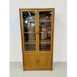 AN OAK EFFECT FINISH PART GLAZED DISPLAY CABINET - W 91CM. D 40CM. H 182CM.