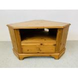 A SOLID HONEY PINE DUCAL CORNER TELEVISION STAND