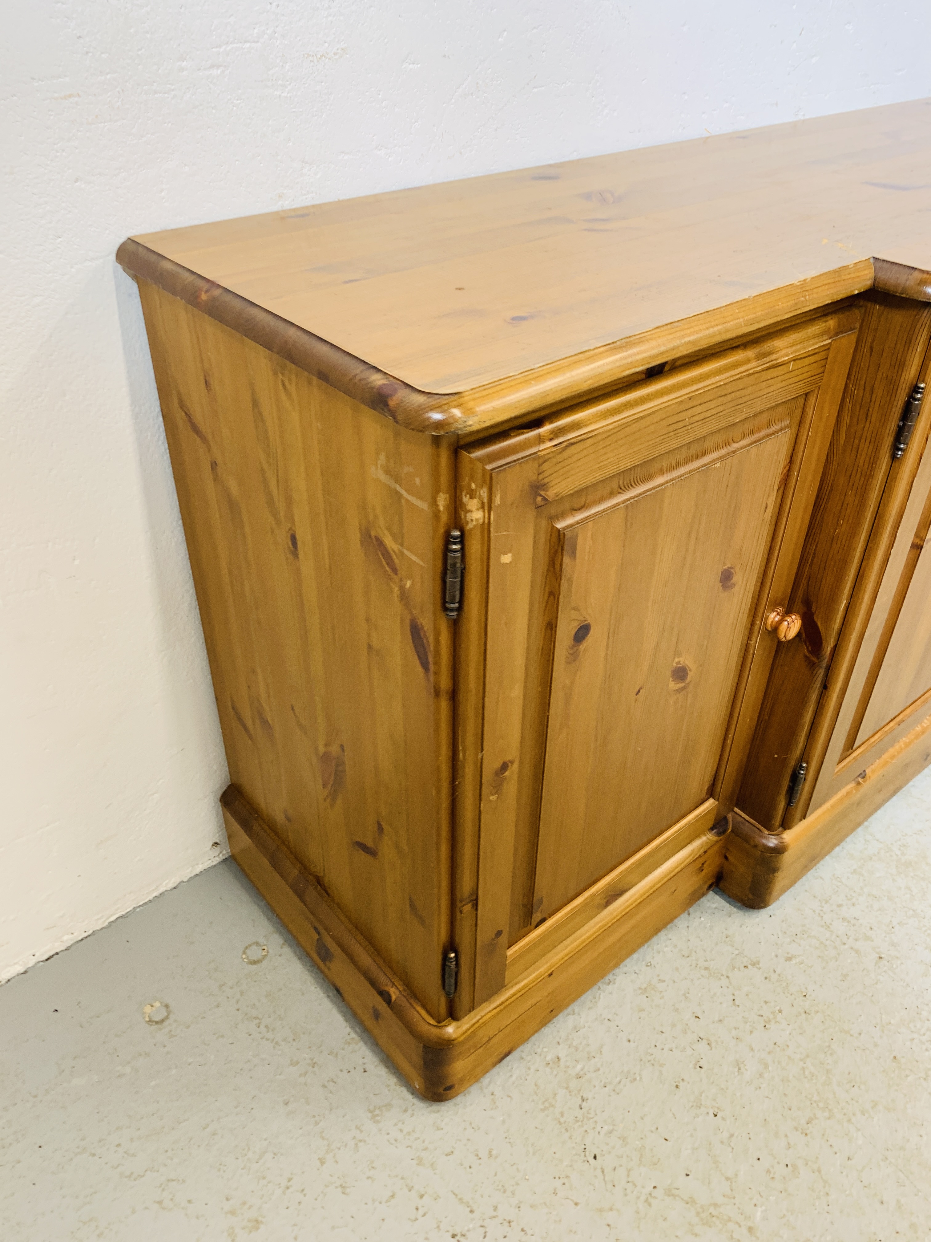 A DUCAL HONEY PINE BREAK FRONT FOUR DOOR DRESSER BASE - W 175 CM. D 46CM. H 75CM. - Image 5 of 9