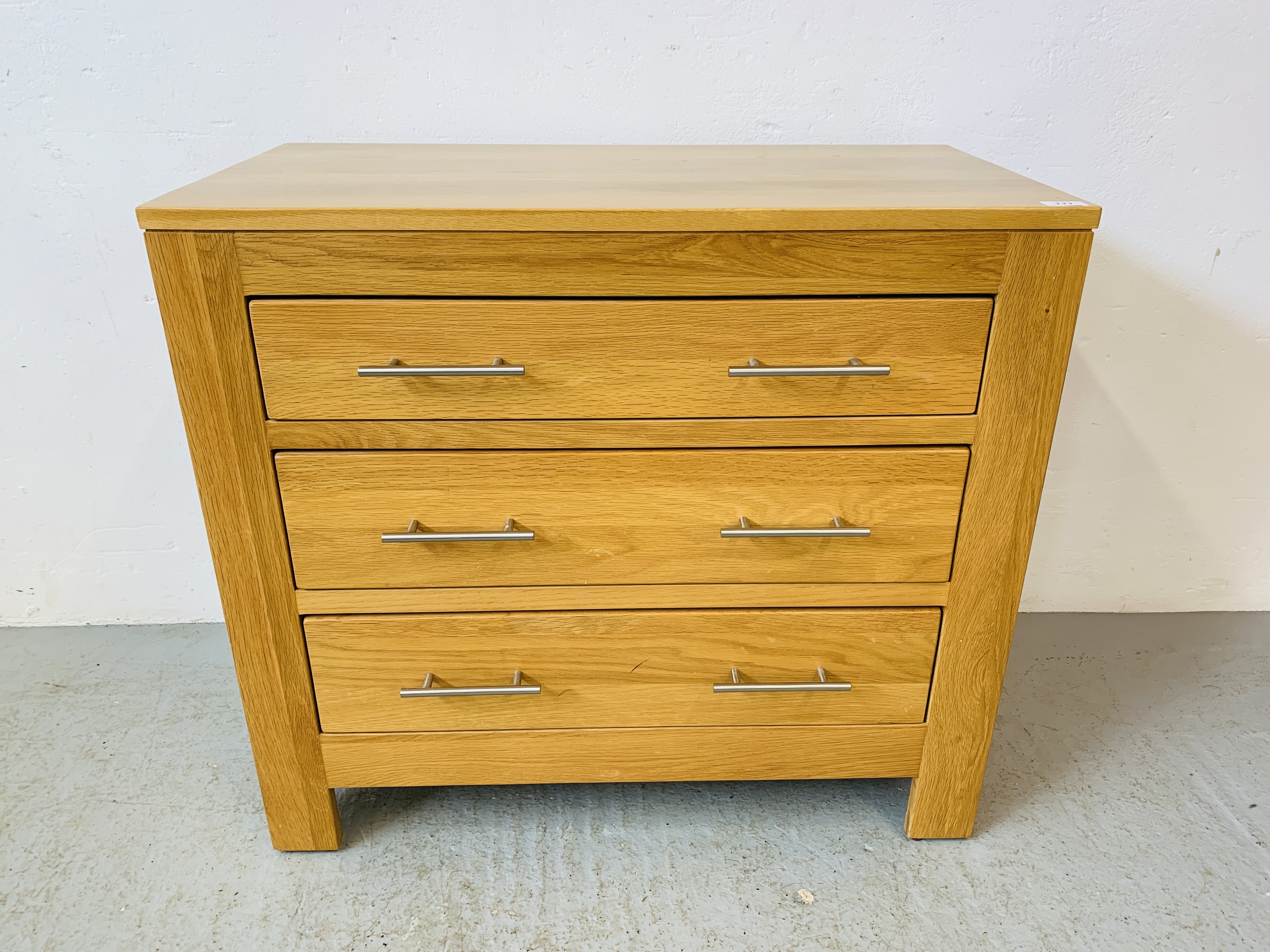 A MODERN LIGHT OAK THREE DRAWER CHEST - W 86CM. D 45CM. H 77CM.