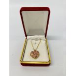 A 9CT ROSE GOLD HEART SHAPED "MUM" PENDANT NECKLACE